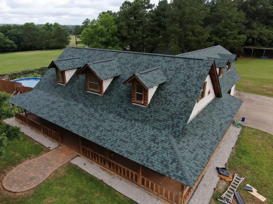 Roof Ryders crew repairing a storm-damaged roof in Lufkin, Texas